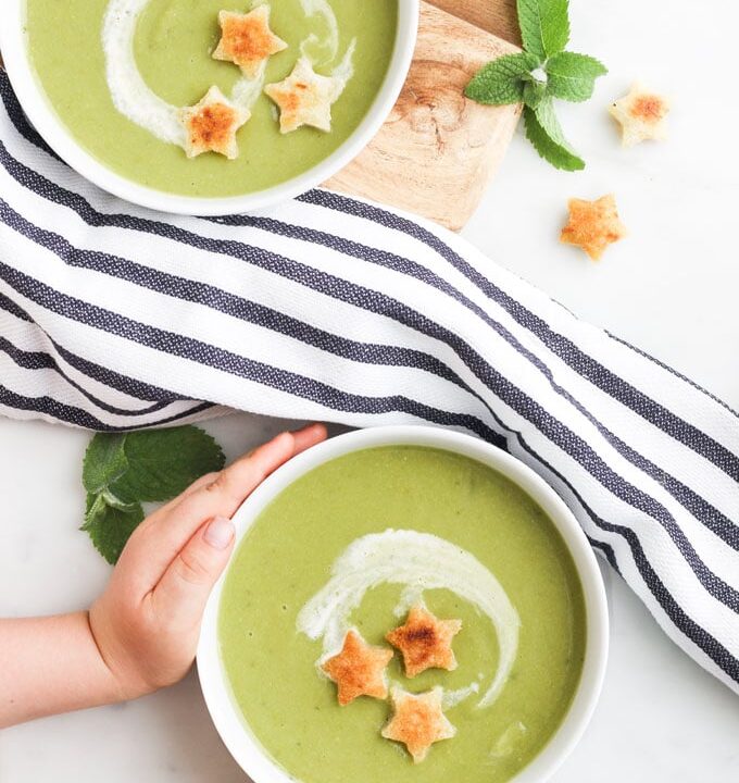 Child Grabbing Plate of Pea and Mint Soup