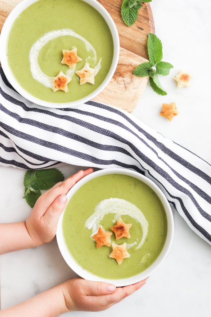 Child Grabbing Plate of Pea and Mint Soup