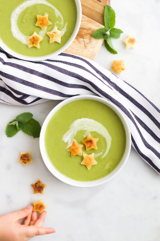 Top Down View of Pea and Mint Soup in Bowls with Star Croutons