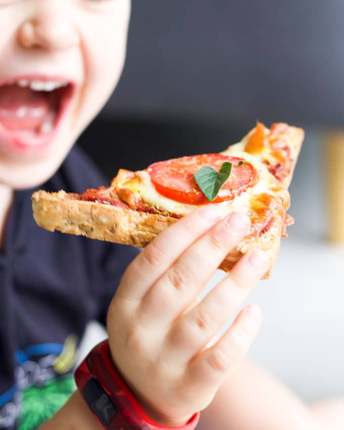 Child Eating Pizza Toast