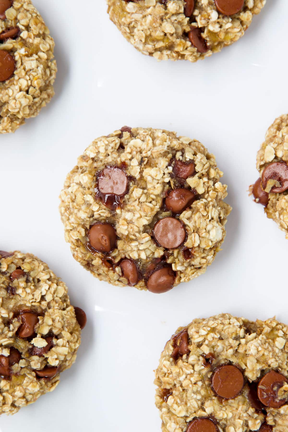 Top Down View of Banana Oat Cookies on White Surface.