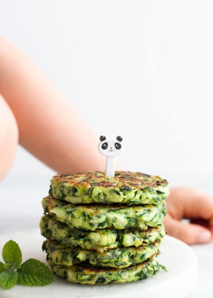 Stack of Zucchini Fritters with Kid Fork Pic on Top