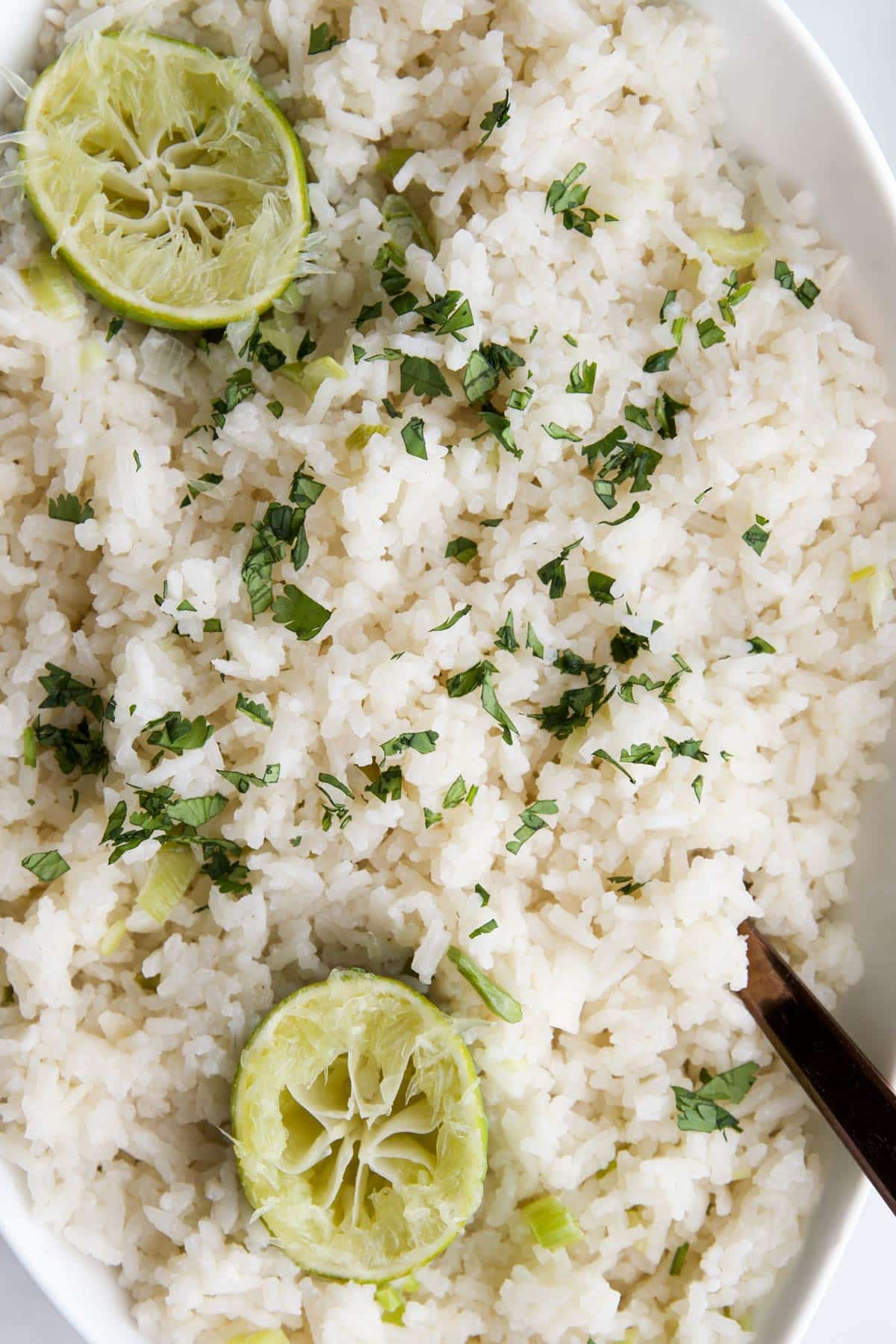 Close Up Shot of Coconut Lime Rice in White Serving Bowl.