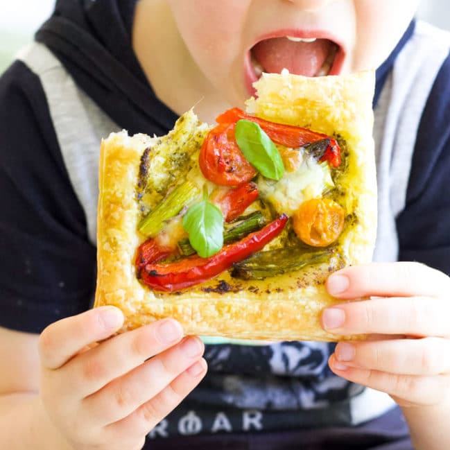 Child Eating Roast Vegetable Puff Pastry Tart