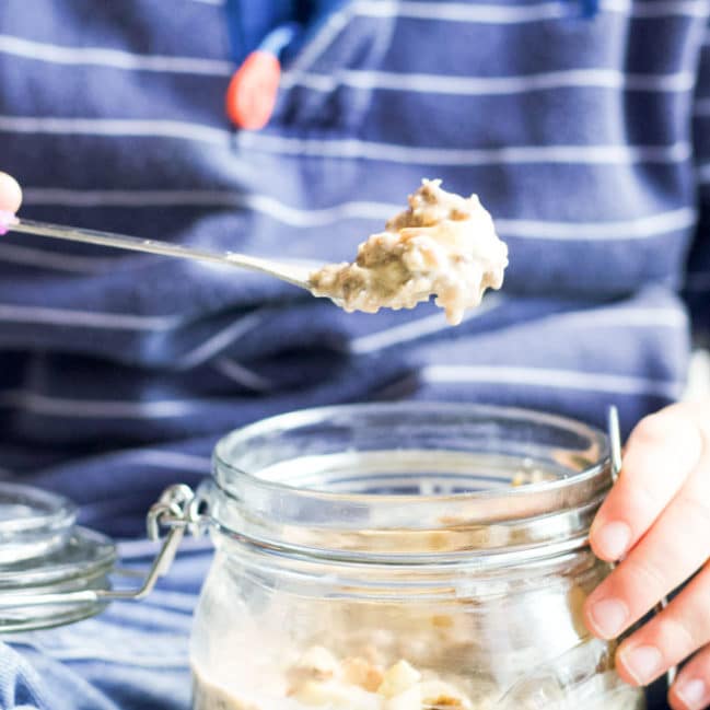 Child Taking Spoon of Overnight Oats from Jar
