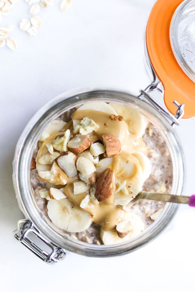 Top Down View of Banana Overnight Oats Topped with Banana Slices and Nuts