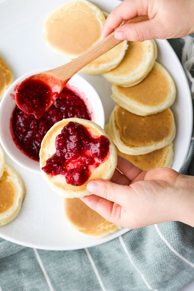 Child Topping Pikelet with Chia Jam