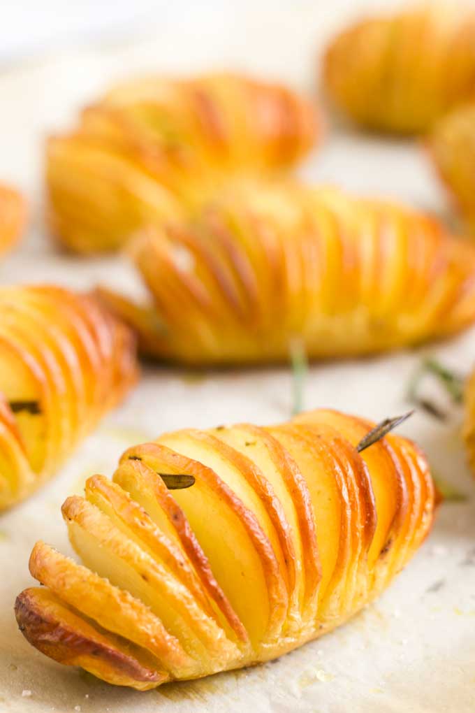 Side View of Cooked Hasselback Potatoes on Baking Tray
