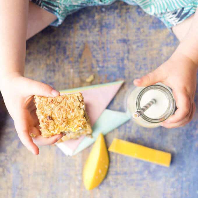 Child HoldingCoconut mango Squares