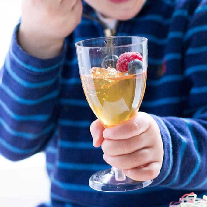 Child Eating Fruit Juice Jelly