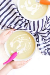 Child Grabbing a Bowl of Leek and Potato Soup
