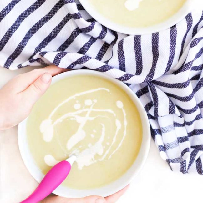 Child Grabbing a Bowl of Leek and Potato Soup