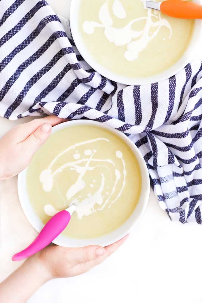 Child Grabbing a Bowl of Leek and Potato Soup