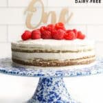 Pinterest Pin for Healthy First Birthday Cake Showing Image of the Cake on a Blue Cake Stand.