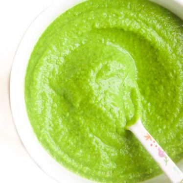 Pea Puree in Bowl with Spoon