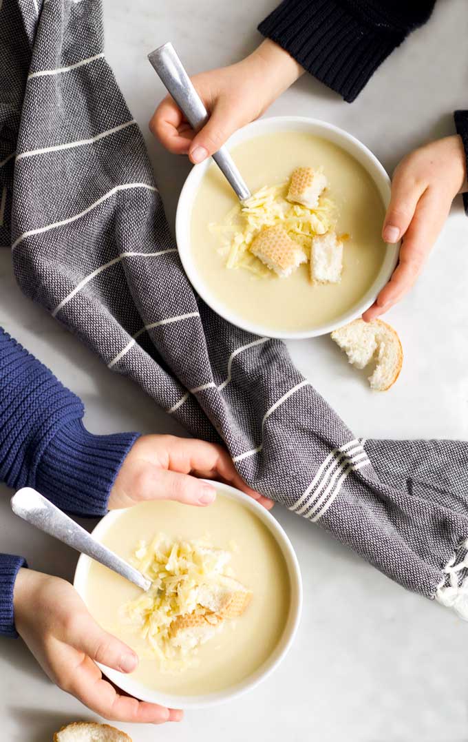Top Down View of Two Bowls of Cauliflower Cheese Soup 