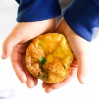 Child Holdin Mini Crustless Quiche in Hands