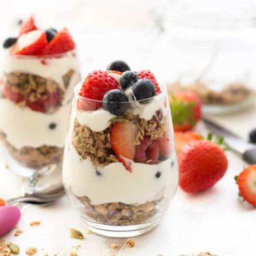 Sugar Free Granola in Glass Container with Granola Spread Around