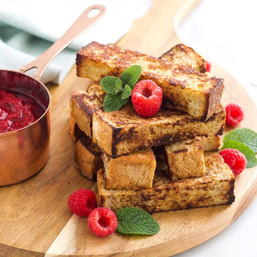 Stack of Eggy Bread Fingers (French Bread Fingers) with Side of Fruit Compote