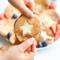 Child Holding Gingerbread Pancake with Apple Star Insert