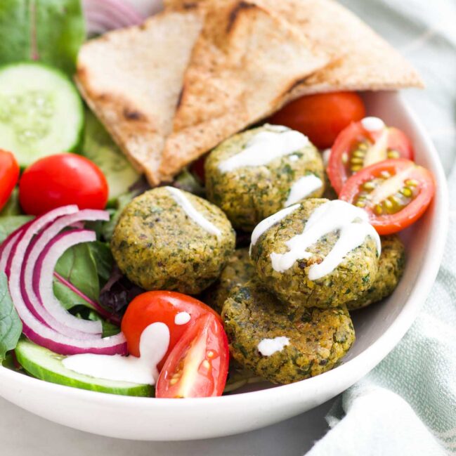 Baked Falafel in Bowl with Salad and Pita Triangles.