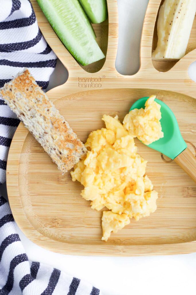 Top Down of Toddler Bunny Plate with Scrambled Egg, Toast, Cucumber Sticks and Banana