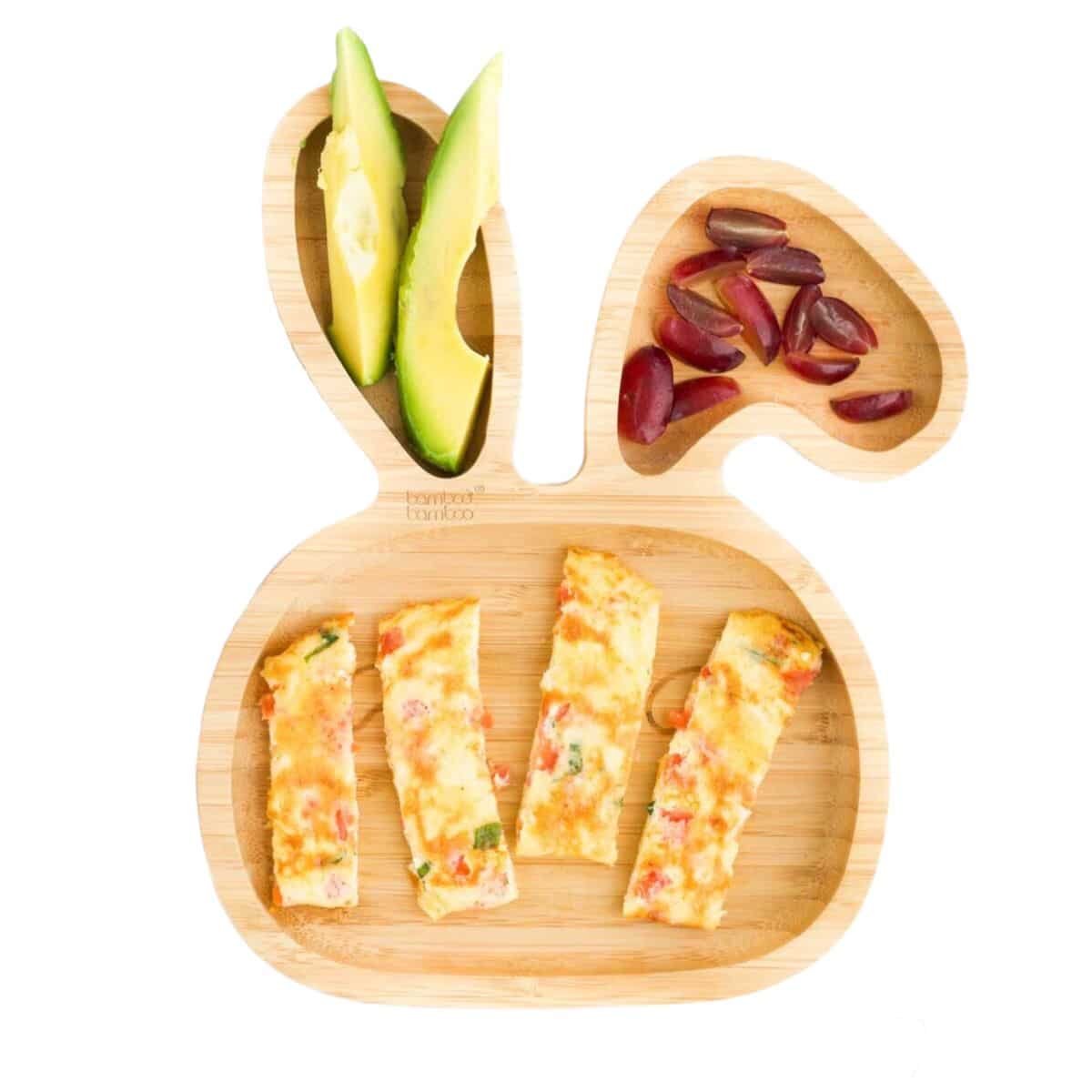 OmeletteStrips on Baby Bunny Plate Served With Avocado Fingers and Cut Grapes. 