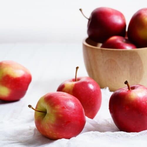 Bowl of Apples in Background with Apples in Foreground