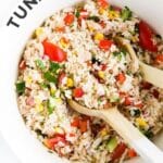 Bowl of Tuna Rice Salad with Wooden Salad Spoons. Text Overlay "Tuna Rice Salad"