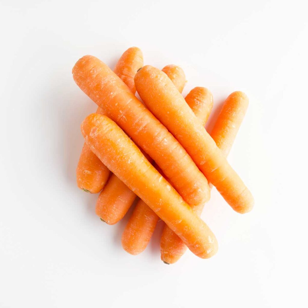 Stack of Carrots on White Background