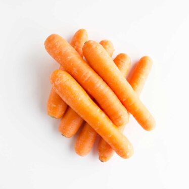Stack of Carrots on White Background