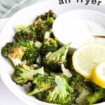 Air Fryer Broccoli Pinterest Pin. (Plate of Air Fried Broccoli with Yogurt Dip with Text Air Fryer Broocoli)