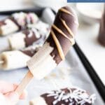 Pinterest Pin. Child Holding Up a Chocolate Dipped Frozen Banana with "Chocolate Frozen Bananas" Text Overlay