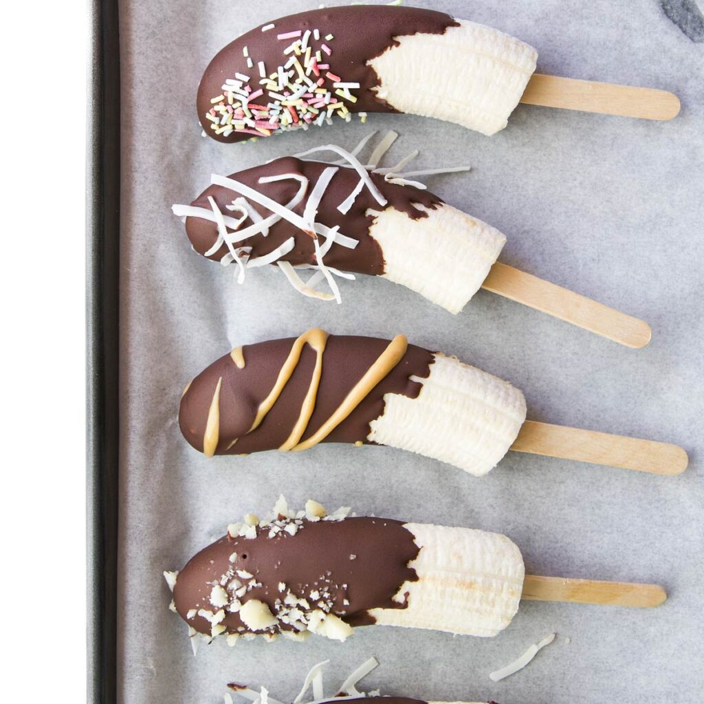 Chocolate Coated Frozen Bananas on Tray