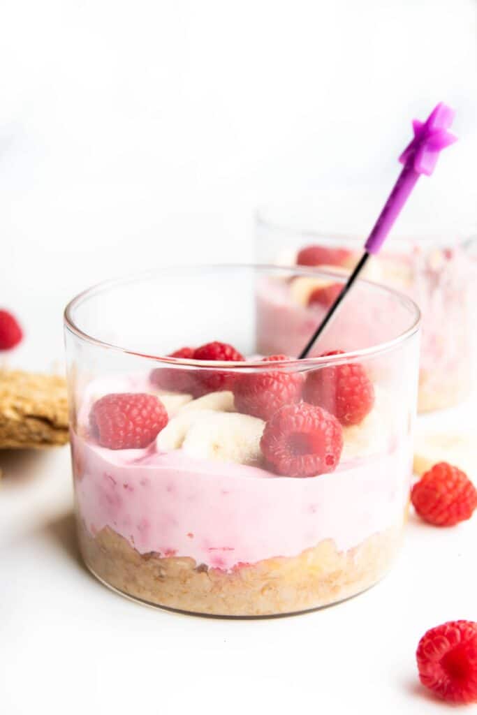 Side Shot of Overnight Weetbix in Glass Container with Spoon