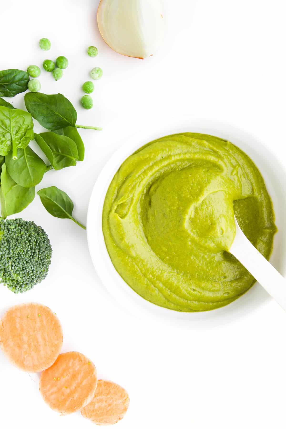 Vegetable Puree in Bowl with Vegetables Scattered Next to It