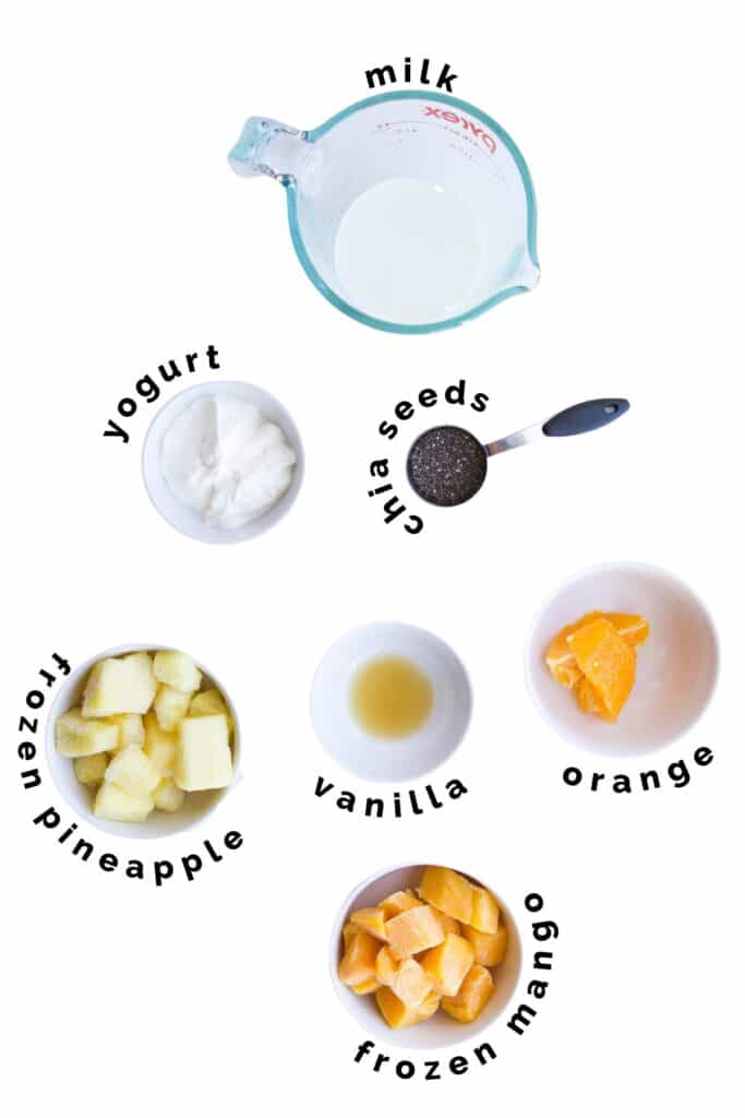 Flat Lay of Ingredients Needed to Make Mango Pineapple Smoothie