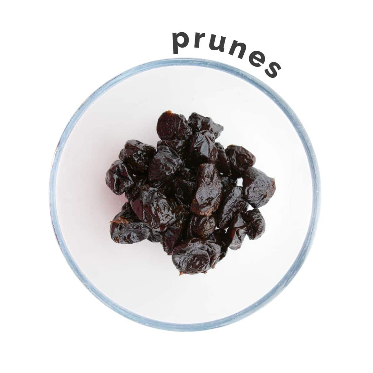 Pitted Prunes in Glass Bowl.