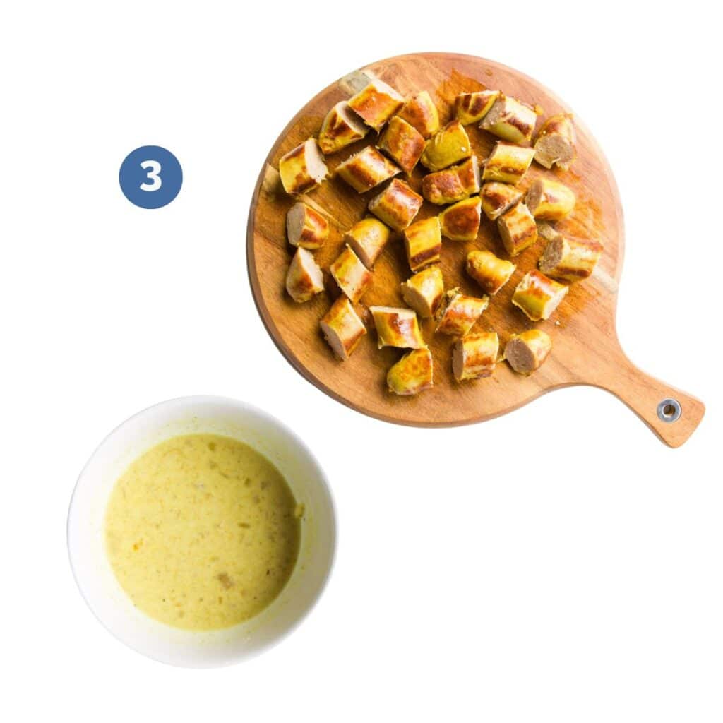 Sausages Chopped on Wooden Chopping Board and Corn Flour in Bowl Mixed with Cooking Liquid.