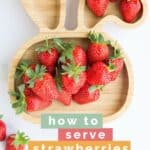 Pinterest Pin with Image of Baby Bunny Plate Filled with Strawberries and Text Overlay "How to Serve Strawberries A BabyLed Weaning Guide".