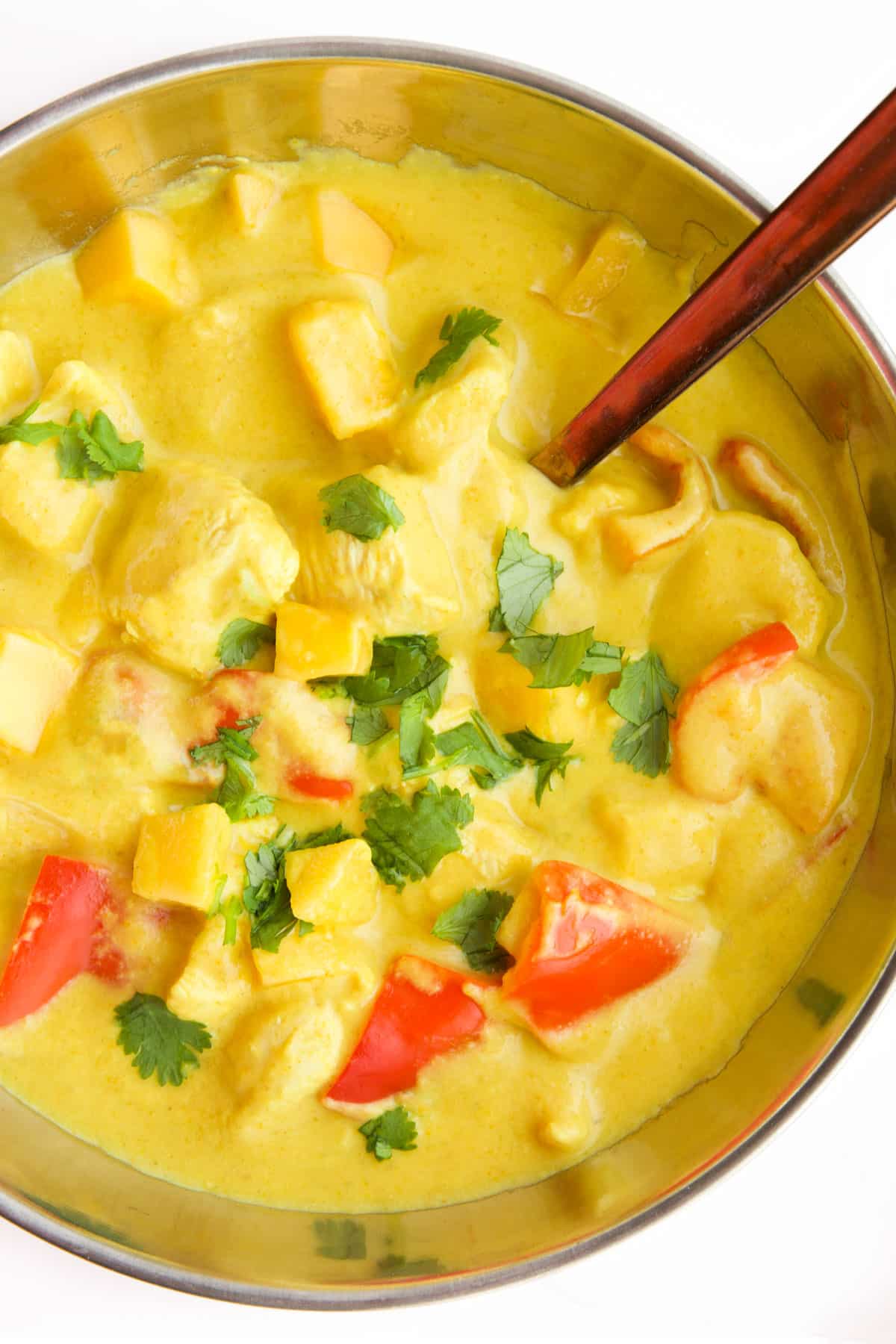 Top Down View of Chicken Mango Curry in Pan.