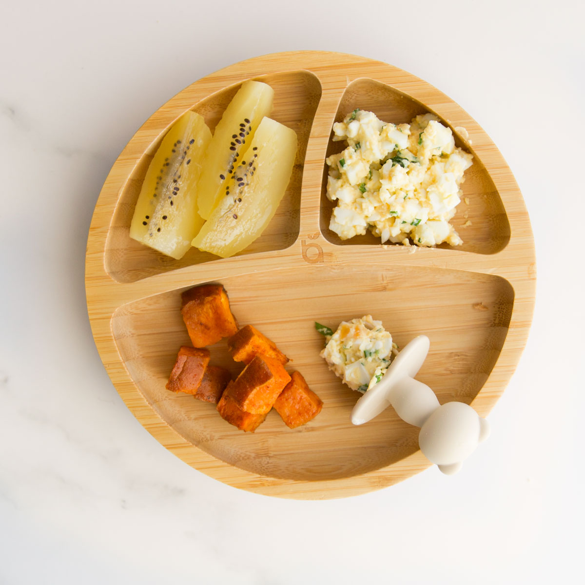 Sectioned Baby Plate with Kiwi, Sweet Potato and Cottage Cheese Egg Salad.