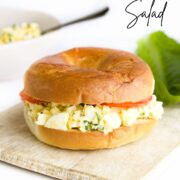 Pinterest Pin Showing Image of A Cottage Cheese Egg Salad Filled Bagel.