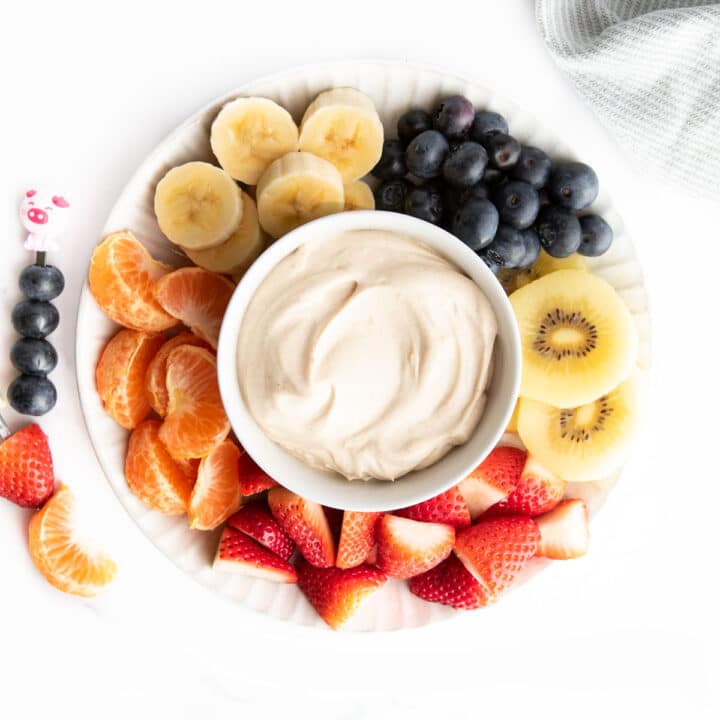 Peanut Butter Cottage Cheese Dip on Plate With Chopped Fresh Fruit.