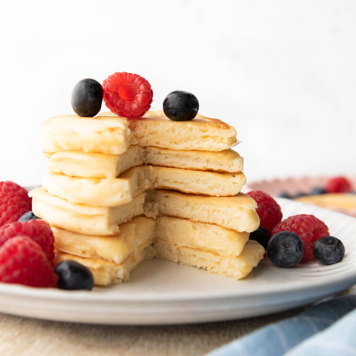 Greek Yogurt Pancake Stack Cut Open to See Fluffy Texture.