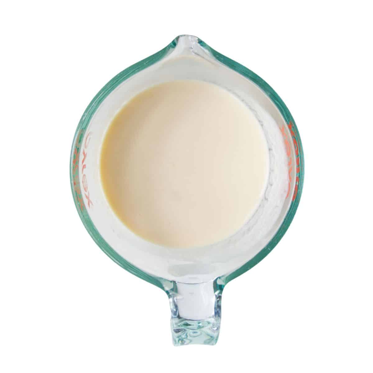 Wet Pancake Ingredients Mixed Together in Jug.